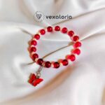 🦋 Elegant Maroon Pearl Butterfly Bracelet – Stretch Fit with Charm Bead